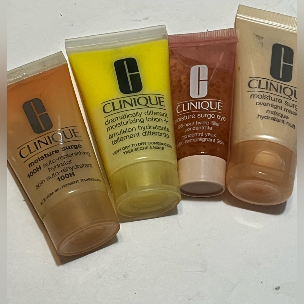 Clinique 4 Pc Skincare Makeup Travel Gift Set Plum Pop Moisture Surge & more